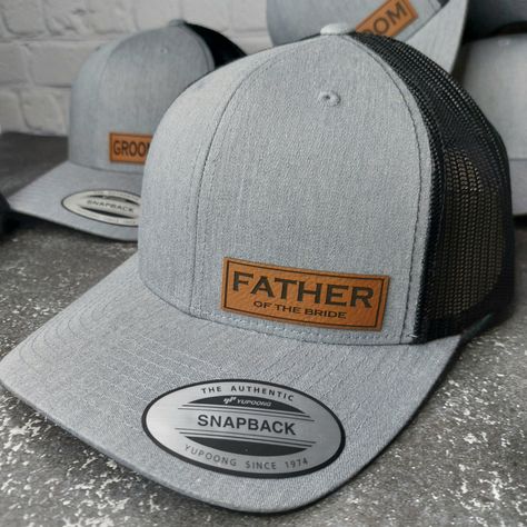 Custom wedding party hats for the perfect wedding pictures! Corner patch on our Premium Mid-Profile Trucker Hats. You can choose GROOM, FATHER of the BRIDE, BRIDE, GROOMSMEN, BEST MAN, GROOMSMAN, etc. or message us for custom requests. We custom make each patch in Branson Missouri U.S.A. We are here to make your wedding day spectacular! HOW TO ORDER - 1. Select your design. GROOM - BRIDE - BEST MAN - GROOMSMAN - FATHER OF THE BRIDE etc. You can also message us with special requests. Examples: Names, Bride, Bridesmaid, Nicknames, etc. 2. Select your hat color.  3. You can change quantities in your shopping cart   Message us ANYTIME with ANY special requests. We are here for you. FOR BULK ORDER DISCOUNTS 6 HATS - 10% OFF Use Discount Code - BULK10 12 HATS - 15% OFF Use Discount Code - BULK15 Groomsmen Baseball Hats, Groomsmen Hats Baseball, Groomsman Hats, Outfits With Ball Caps, Groomsmen Hats, Groom Hat, Perfect Wedding Pictures, Bridal Party Hats, Country Western Wedding