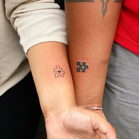 Explore the ultimate guide to couple tattoos, from choosing meaningful designs to selecting the perfect placement. Celebrate love with a unique ink story! Hidden Couple Tattoos Unique, Couple Puzzle Piece Tattoo, Tattoo Ideas Relationships, Tiny Couple Tattoos Meaningful, Puzzle Piece Tattoo Couples, Couple Matching Tattoos Relationships, Funny Couple Tattoos, Couples Tattoos Unique, Unique Couple Tattoo