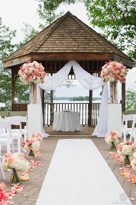 Lakeside Taboo Resort Wedding  Read more - http://www.stylemepretty.com/canada-weddings/ontario/muskoka/2014/01/28/lakeside-taboo-resort-wedding/ Gazebo Wedding Decorations, Wedding Setup, Wedding Ceremony Ideas, Gazebo Wedding, Wedding Event Design, Lakeside Wedding, Coral Wedding, Outdoor Wedding Decorations, Aisle Decor