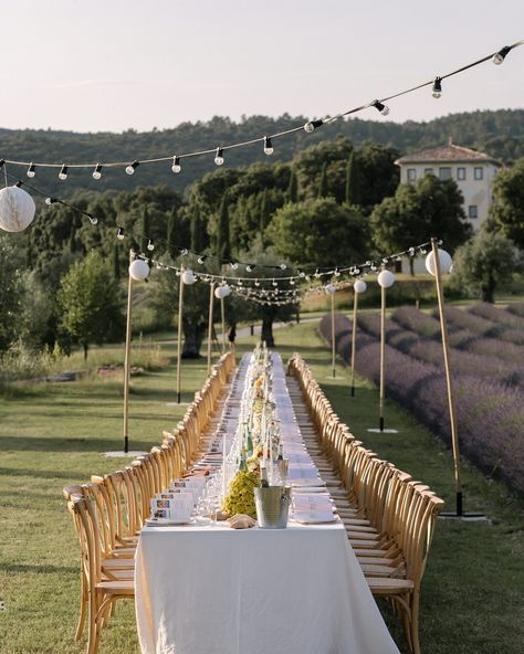 Marjorie + Joey | june 2024 | the longest dinner table set up ever at @lesdomainesdepatras • when I met @marjorie.artieres , creative director of @pinchfooddesign in nyc , I understood from the first mail that we would get along perfectly 🫶🏻 from the cocktails , the giant dessert made of Baba au rhum , the bread hanging from lamps , to the 50 meters long table to feed their 150 guests , very Provence , so colorful , it was the coolest to share the creative process with her - Joey , Marjorie ,... One Long Wedding Table, Long Dinner Table Wedding, Dinner Table Set Up, Dinner Table Set, Long Table Wedding, Patras, Dinner Table Setting, Table Wedding, June Wedding