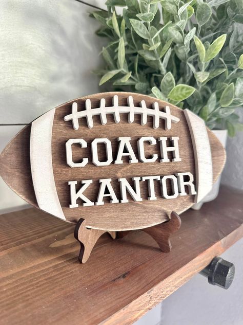 Personalized Desktop Football Coach Sign  - Gifts for Football Coach - PE Coach Gift Personalized - Gifts for Coaches - Football Coach  This sign is 7.8 inches by 4.5 inches made with 1/4 inch wood and 1/4 wood cut out letters. Each football comes with a stand perfect to sit on your favorite coaches desk!  These make great gifts for  end of year gifts, Christmas or back to school!  We make every sign out of real wood - because of this each sign will be unique and have its own variation of knots Gifts For Coaches, Football Player Gifts, Football Team Gifts, Football Banquet, Football Coach Gifts, Coach Appreciation Gifts, Coaches Wife, Football Diy, Football Spirit