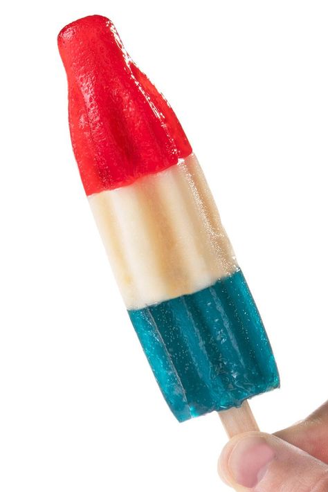 These gummy treats recreate the red (cherry), white (berry blast), and blue (blue raspberry) flavors on a popsicle stick of similar iconic frozen popsicles. Cottage Bedroom Decor, Frozen Popsicles, Candy Photography, Rocket Pop, Simple Birthday Decorations, Snack Treat, Popsicle Stick, Red Cherry, Fruit Smoothie Recipes