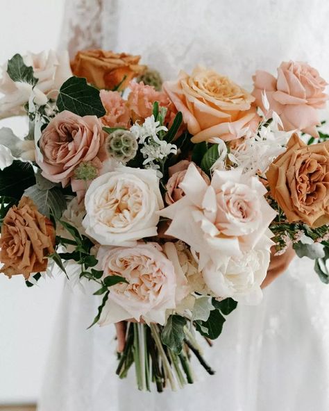 Jade and Joel's stunning summer wedding in Noosa brought peach, apricot, and caramel hues to life. Jade's bouquet was a floral masterpiece, filled with roses, lisianthus, scabiosa pods, tweedia, dried grasses, wax flowers, and lush greenery foliage. 🤍 Wedding details 🤍 Florals: @willowbudflowers Photographer: @lukemiddlemissphotography Stylist: @lovebirdweddings Venue: @rickysweddings   Planning your dream Noosa wedding? Head to our website to find Noosa’s leading wedding suppliers all... Taupe And Peach Wedding, Peach And White Wedding, Wedding Flowers Peach And White, Peach And Green Flowers, Cream And Peach Wedding Flowers, White Peach Wedding Bouquet, Peaches And Cream Wedding Flowers, Peach And Cream Bridal Bouquet, Lisianthus Bouquet