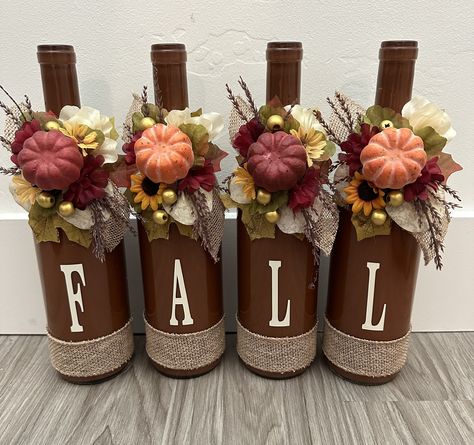 Add a touch of fall to your home!! Custom wine bottle home decor sets made to order. They make the perfect gift and home decorative accent.  We offer custom sets to match your home decor theme, please send us a message and we would be happy to create a beautiful piece for you or that special someone. Wine Bottle Fall Decor Diy Projects, Wine Glass Fall Crafts, Red Wine Bottle Crafts, Fall Craft Projects Home Decor, Fall Wine Bottle Decor, Thanksgiving Wine Bottle Crafts, Wine Bottle Fall Crafts, Fall Bottle Crafts, Natural Thanksgiving Decor