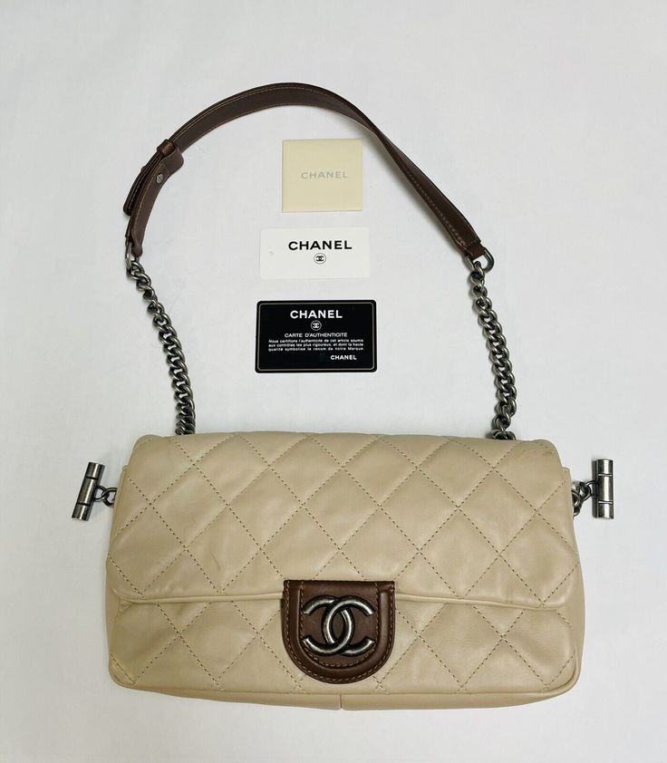 Authentic Original Chanel Classic Single Flap Bag Beige New with Tag Bag is Authentic Original from Chanel. Its new never been used. It was kept in a storage place and  its really not a it has few minor marks on bag for been in storage. Please see pictures for more details. Please message us if you have any questions.  Terms and Conditions: This item carry 30 days warranty covering repair or replacement. And 14 days for refunds with a 20% restocking fee. Return must be in the original condition and unused. RETURNS NOT ACCEPTED ON ITEMS LISTED "AS IS" OR "FOR PARTS & REPAIR". We do not warranty battery or software related issues. Batteries are AS-IS, they are not tested. Software is pre installed for you, but does not include recovery cd's or manuals. Buyers lack of knowledge of software, d Designer Flap Bag With Cc Turnlock For Daily Use, Luxury Travel Flap Bag With Silver-tone Hardware, Luxury Flap Bag With Silver-tone Hardware For Travel, Designer Beige Flap Shoulder Bag, Luxury Beige Bags With Silver-tone Hardware, Designer Beige Flap Bag With Removable Pouch, Designer Beige Flap Bag With Detachable Strap, Designer Beige Flap Bag, Designer Beige Leather Flap Bag