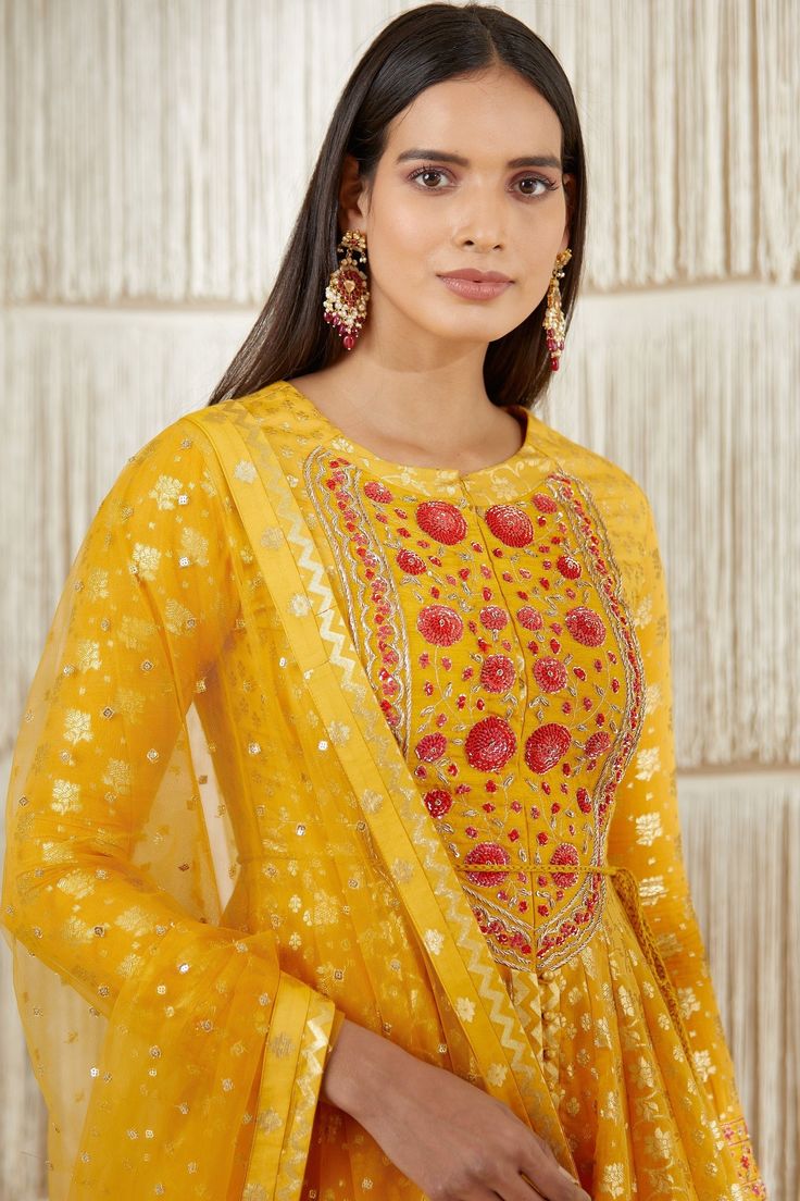 Editor's Note Zardozi Embroidered Chanderi Brocade Anarkali With Net Dupatta And Rayon Twill Trouser Color: Mustard Fabric: Chanderi Brocade, Net And Rayon Twill Trouser Embroidery Details: Zardozi Embroidery Care: Dry Clean Only About the Designer Shyam Narayan Prasad started his journey in the Indian Fashion Design Industry with a couture women’s wear collection. The designer has a womenswear label focussing on Indian ethnic wear which ranges from bridal lehengas, saris, and festive kurtas to Festive Resham Embroidered Anarkali Set For Transitional Season, Festive Resham Embroidery Anarkali Set For Transitional Season, Festive Anarkali With Resham Embroidery, Traditional Designer Anarkali Set With Dupatta, Traditional Anarkali Set With Dupatta For Designer Wear, Resham Embroidered Chinon Anarkali Set For Navratri, Anarkali Sharara With Dupatta For Festive Occasions, Festive Floor-length Anarkali Set With Zari Work, Navratri Resham Embroidery Anarkali Set In Chinon