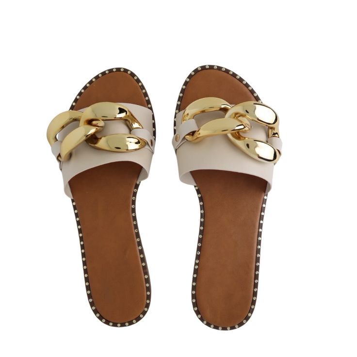 •Slip on entry •Lightly padded insole •Beige|sand in color •Vegan leather | Gold chain detail & bullets •True to size Synthetic Sandals With Chain Strap For Vacation, Vacation Sandals With Chain Strap And Synthetic Material, Vacation Sandals With Chain Strap And Round Toe, Vacation Sandals With Chain Strap, Casual Sandals With Chain Strap And Round Toe, Flat Sandals With Chain Strap And Synthetic Material, Trendy Beach Sandals With Chain Strap, Chic Gold Chain Sandals For Summer, Casual Sandals With Chain Strap For Vacation