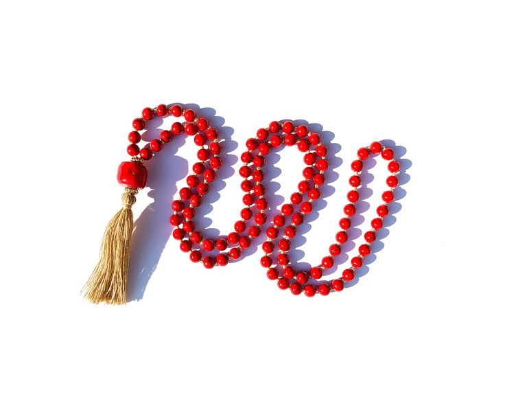 This beautiful red Japa mala is hand knotted out of 108 6mm red dyed Howlite beads and large natural Coral bead.  Mala is finished with 18kc real gold coated brass beads and tassel.  Mala is 47cm long ( tassel is 6cm and 1.5cm Coral bead) and comes with hand dyed bag of your choice- please see photo with bags. Red 8mm Beads Jewelry For Meditation, Red Hand-strung Jewelry For Meditation, Handmade Red Mala For Healing, Red 8mm Beads Spiritual Mala, Red Hand-strung Spiritual Mala, Red Round Beads Mala For Meditation, Red Mala For Meditation With Round Beads, Red Mala With Round Beads For Meditation, Red Handmade Mala For Healing