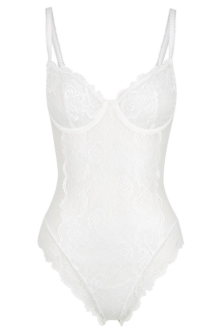 The Elodie bodysuit is truly show-stopping and a lace lover's dream. With soft-to-touch lined white mesh and lace body detailing, this bodysuit has goddess written all over it. Wear it in or out, you decide. Perfect for an exposed lingerie look Lace lined cups Adjustable straps Strap detail Open close press stud gusset Carefully crafted with soft stretch mesh Cold hand wash only, dry flat in shade. Poly/Elastane 100% Cotton gusset Our model Nikki is a 32C & size 4 and wears a size small. She White Lace Bodysuit, Silk Bodysuit, White Lace Lingerie, Small Bra, Body Dentelle, Body Suit Outfits, Lace Body, Inner Goddess, Lace Set