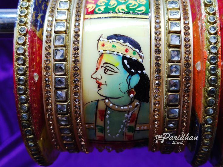 Acrylic Bangles are long durable. Kundan Radha Krishna Indian bangles/chuda set. Ideal for Traditional functions, Weddings, Receptions, Ethnic wear, and Party wear Festive. Best for gifting purposes. you can also gift to your loved ones. There may a slight difference in colour due to photography and brightness adjustments in the monitor screen. Keep Bangles away from Direct Perfume, Deo, Water, Spray-On The Jewellery. First Wear Your Makeup, Perfume - Then Wear Your Jewellery. Heavy Lehenga For Festivals, Heavy Traditional Drape Choli, Traditional White Bridal Sets For Ceremonial Occasions, Diwali Traditional Heavy Lehenga, Traditional Heavy Lehenga For Navratri, Traditional Heavy Lehenga For Diwali, Traditional Heavy Lehenga For Festivals, Heavy Kundan Dupatta For Festivals, Bollywood Bridal Sets With Zari Work For Festivals