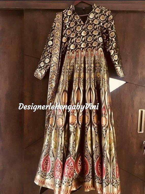 Custom made panneled anarkali paired with a dupatta perfect for all festive and wedding occasions.Size-Custom made as per your size so message us for the size chart.Manufacturing time- 10 daysFabric details-Pure hand woven banarasi pannelesDupatta- Georgette Floor-length Brocade Choli With Dupatta, Brocade Dupatta With Dabka Work For Reception, Anarkali Jamawar Gown With Dupatta, Wedding Anarkali Unstitched Brocade Suit, Designer Brocade Dupatta With Dabka Work, Traditional Draped Lehenga With Sheer Dupatta In Jamawar, Floor-length Jamawar Dress For Reception, Gold Anarkali Set In Jamawar, Gold Anarkali Jamawar Set