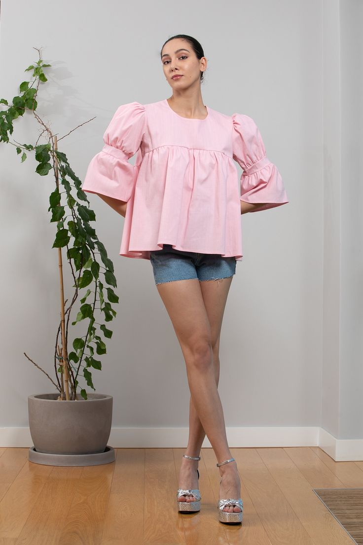 "Super cute pink linen top with ruffles from our new SS Collection. Cut in heavy linen, with ruffle sleeves and loose deisgn - our pink ruffle linen top is a very good choice for hot summer days. Complete your look with short jeans or palazzo linen pants.  Fabrication : Linen and Cotton Mix Color : Pink ( if you need another color, please contact us and we will do our best to offer you the desired color )  Same one in baby blue: https://www.etsy.com/listing/1424123098/blue-linen-top-blue-ruffle- Pink Ruffle Top With Flutter Sleeves, Pink Puff Sleeve Cotton Blouse, Cotton Peasant Top With Puff Sleeves And Ruffles, Cotton Peasant Top With Ruffles And Puff Sleeves, Cotton Ruffle Blouse For Brunch, Pink Flutter Sleeve Top For Brunch, Cotton Ruffles Blouse For Brunch, Pink Blouse With Gathered Sleeves For Daywear, Feminine Pink Linen Top