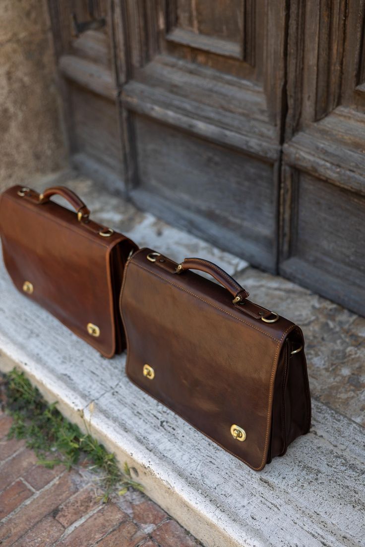 Elevate your professional style with our Handmade Italian Leather Laptop Bag, a perfect blend of luxury and practicality. Crafted from the finest Tuscan vacchetta leather, this laptop bag showcases the rich heritage and artisanal skill of Montepulciano. Designed to accommodate your laptop and essential documents, this bag is ideal for both men and women, making it a perfect choice for business and everyday use. Features:  ● Premium Material: Made from 100% genuine Tuscan vacchetta leather, celeb Elegant Laptop Bag With Leather Handles For Business Trips, Italian Leather Briefcase For Formal Use, Classic Leather Case With Laptop Sleeve, Elegant Leather Case With Laptop Sleeve, Classic Leather Briefcase With Laptop Sleeve, Organizing Documents, Vintage Briefcase, Italian Bags, Montepulciano