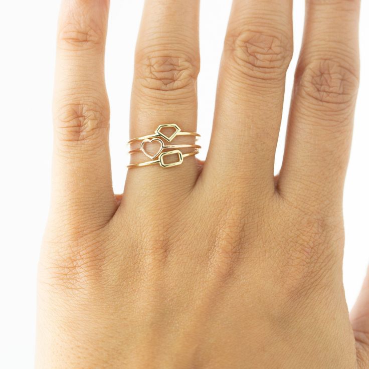 Show your love for her with our shaped dainty ring. It features a light dainty band, and a cute heart shape on top to always remind her of your love. Stack great with our other rings as well! Available in your choice of: Solid 14k & 18K Golds, Silver, or Gold Plated over Silver Base 1.2mm-1.4mm average width Dainty Double Heart Promise Jewelry, Rose Gold Stackable Midi Rings For Promise, 14k Gold Promise Midi Ring, Dainty Adjustable Rings For Promise Occasion, Dainty Adjustable Ring For Promise, Simple Gold Stackable Rings For Promise, Open Ring Stackable Promise Rings, Promise Stackable Open Rings With Details, Adjustable Tiny Rose Gold Rings