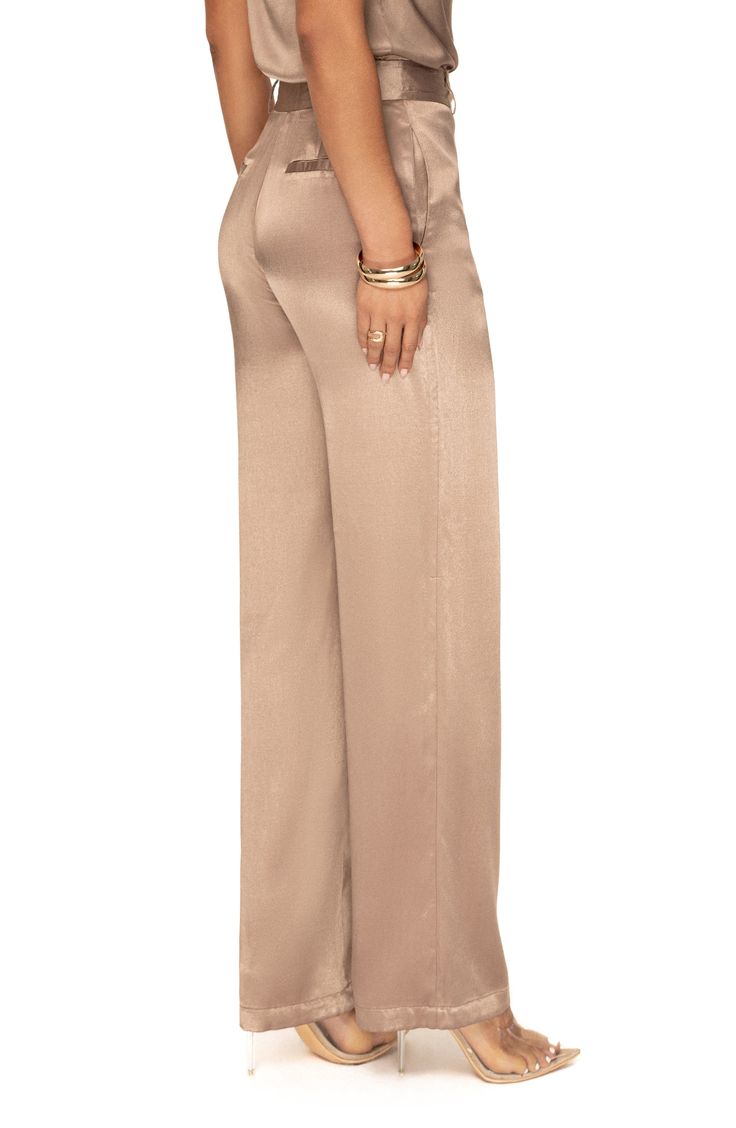 Make a casual-chic statement whether you're on or off the clock with these wide-leg pants made from lustrous satin. Zip fly with hook-and-bar closure Side-seam pockets; back welt pockets Lined 55% rayon, 45% viscose Hand wash, dry flat Imported Champagne Satin Pant Suit, Cream Formal Pants Outfit, How To Style Silk Pants, Elegant Gold Silk Bottoms, Gold Silk Bottoms For Party, Chic Sheen Bottoms For Spring, Chic Spring Bottoms With Sheen, Chic Spring Sheen Bottoms, Elegant Satin Pants