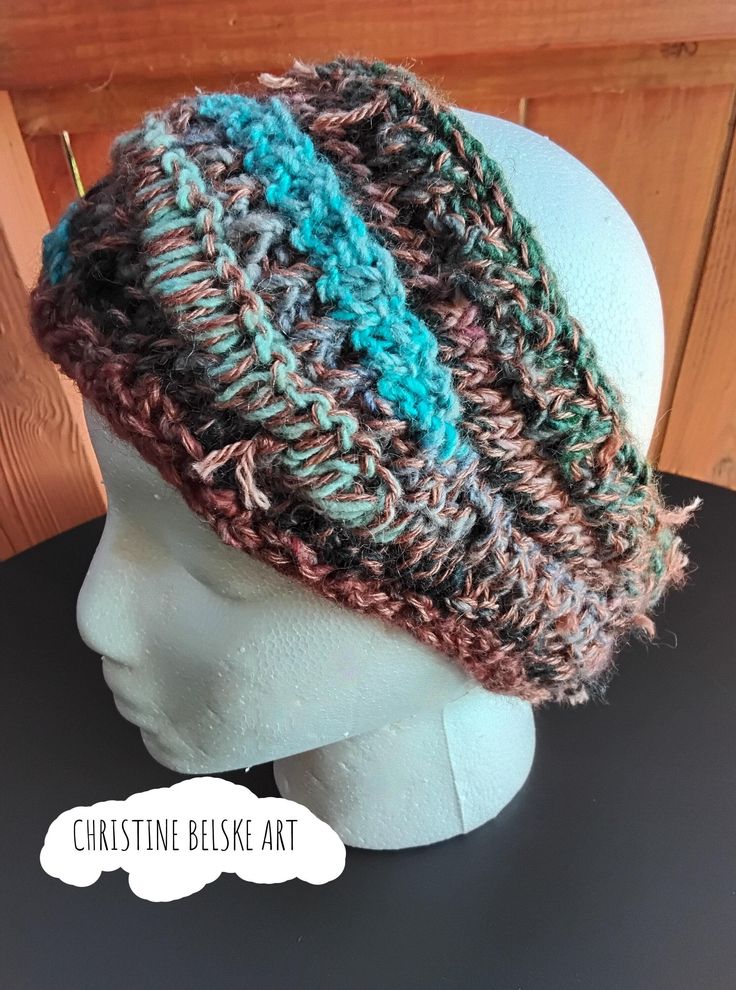 I designed and knit this unique freeform headwrap in a trippy, colorful mix of high~end fibers from my local yarn shop.  The colors are a crayola mosh pit of turquoise, greens, rust and earthtones. The fibers are a decadent blend of locally sourced alpaca, wool and silk. MEASUREMENTS: Designed to fit most ~ headwrap measures approximately eleven inches WIDE when laid flat. CIRCUMFERENCE stretches to about 22~24 inches around. HEIGHT from top to bottom varies slightly because of the freeform knit technique used~ but ranges from around 3~4 inches throughout.  CARE INSTRUCTIONS: Hand wash in COLD water with a mild detergent suitable for wool and silk, gently squeeze excess water, lay flat to dry.  Please don't hesitate to contact me if you have any questions.  Thank you for supporting handmad Bohemian Winter Headwrap One Size, Bohemian One Size Winter Headwrap, Bohemian One-size Winter Headwrap, Handmade Bohemian One Size Headband, Bohemian Handmade One-size Headband, Handmade Bohemian One-size Headband, Handmade Yarn Headband, One Size, Handmade Yarn Headband One Size, Hand Knitted One Size Headband For Winter