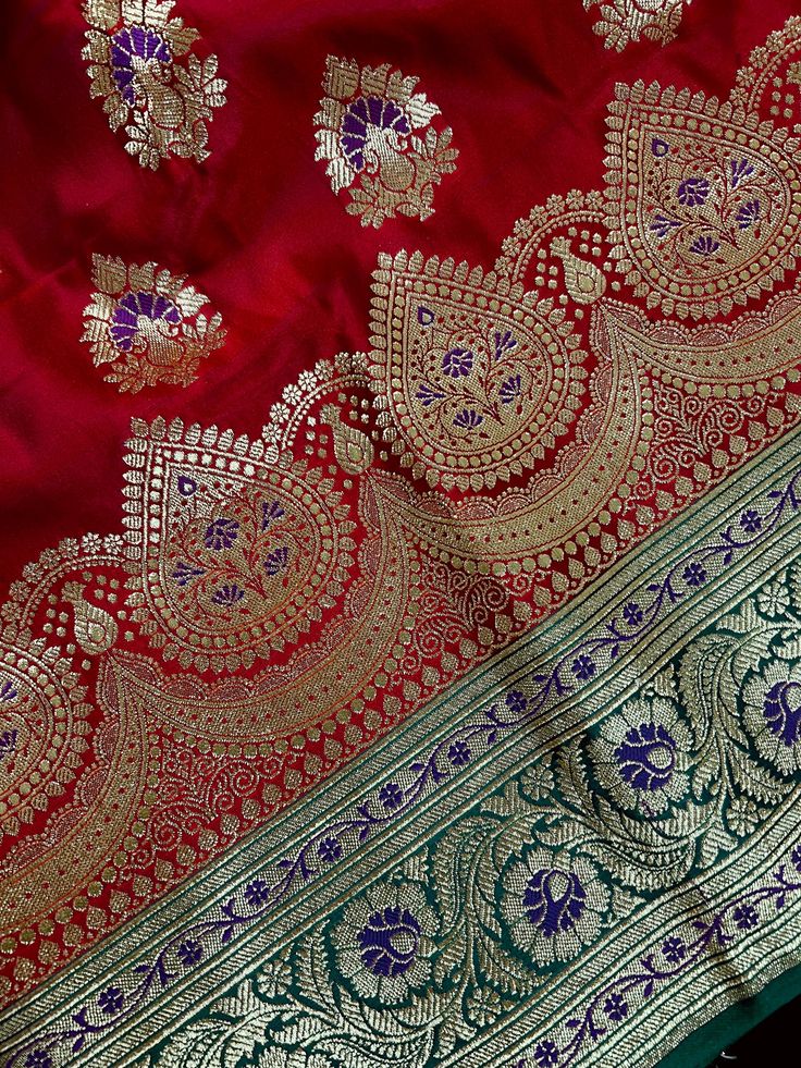 Traditional BrightPlease note -: There are threads on the back side of the Saree. Saree is heavy in weight - 3lb approx. Item : SareeColor : Bright Red and Green Base Fabric : Banarasi Satin Silk Blouse piece : Comes with Blouse pieceFall & Edging (Yes/No) : Yes Disclaimer -:- Color variation is possible due to various reasons like phone or desktop setting, resolution etc. Please don't hold us responsible. Our aim is to put the exact color of the Saree.- If the Saree is Pure Silk, we will put it Traditional Meenakari Choli For Festivals, Traditional Meenakari Choli For Diwali, Ceremonial Red Choli For Transitional Season, Red Dupatta With Motifs For Transitional Season, Transitional Red Dupatta With Motifs, Traditional Meenakari Wear For Festivals, Traditional Red Ceremonial Lehenga, Red Paithani Silk Traditional Wear With Motifs, Red Paithani Silk Traditional Wear With Cutdana