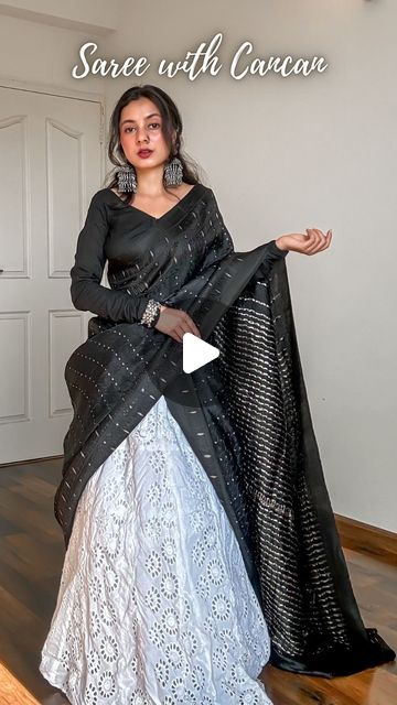 𝐀𝐫𝐜𝐡𝐞𝐞 | Saree Drapes on Instagram: "Save and send this Saree on Lehenga tutorial to a saree lover 🖤

Draped a pure silk saree in mulberry with tanchoi weave on deep black body topped with sterling silver zari woven 1000 butas and a classy double border.

Created a unique saree draped or unique saree styling tutorial for saree beginners. Paired it with a cancan and a long flared skirt. Added oxidised jewellery to complete the look.

How to wear a saree on cancan-
🖤 Pick lightweight pure silk sarees fabric like Katan silk, mulberry silk, tussar silk, khaddi chiffon, khaddi georgette, gajji silk and assam silk.
🖤 Layer up your cancan as much as you want but make sure it’s easy to walk in.
🖤 You can drape the saree in half saree pattern or as a regular saree depending upon the fabri Styling Saree With Tops, Different Half Saree Draping Styles, Saree To Lehenga Draping, Saree Draping In Lehenga Style, Saree To Half Saree, Half Saree With Saree, How To Wear Half Saree, Saree With Lehenga Drape, Lehnga Saree Drape