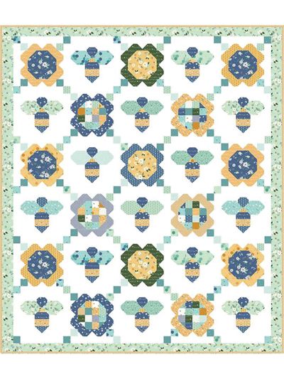 a quilt pattern with flowers and hearts on the front, in blue and yellow colors