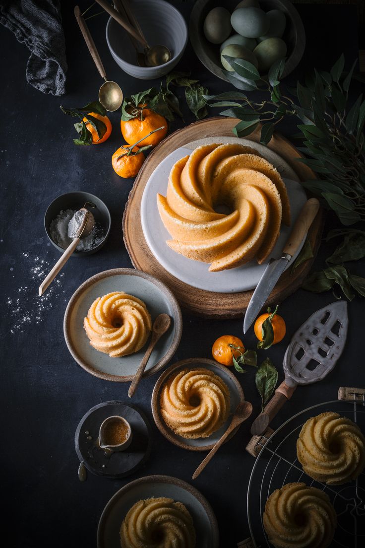 an image of some food that is on the table with utensils and oranges