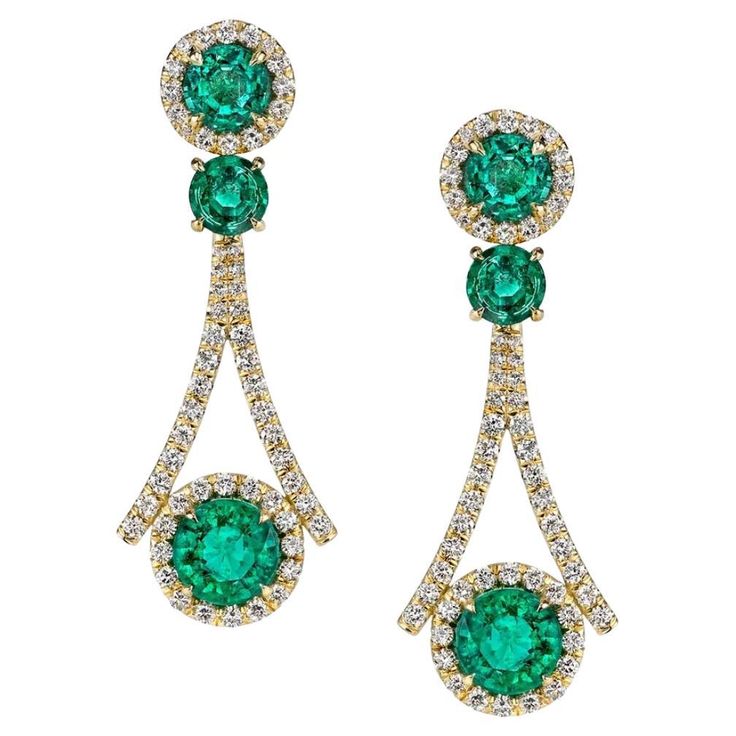 A sumptuous design crafted of 18K yellow gold completes these glittering forest green glowing earrings. Featuring 7.19 carats of perfectly intense Zambian Emeralds, embedded by 1.89 carats of white glistening diamonds. Luxury Green Diamond Earrings With Prong Setting, Luxury Green Emerald Diamond Earrings, Formal Green Diamond Gemstone Earrings, Green Diamond Earrings For Evening, Formal Green Gemstone Diamond Earrings, Elegant Green Diamond Earrings With Brilliant Cut, Luxury Emerald Earrings With Prong Setting, Luxury Green Earrings With Prong Setting, Green Luxury Earrings With Prong Setting