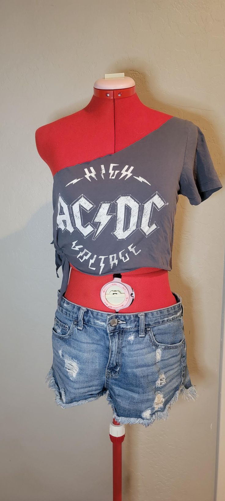 Upcycled AC/DC t shirt. Great for a music festival or event, Coachella, Knotfest, or Bike Week. this is a size medium (size tag pictured), but now that the side has been cut, it's adjustable to your size. Summer Distressed Band Merch T-shirt, Edgy Festival T-shirt With Crew Neck, Fitted Short Sleeve T-shirt For Festivals, Casual Distressed T-shirt For Festivals, Edgy T-shirt For Spring Music Festival, Edgy Band Logo T-shirt For Summer, Distressed Cotton Tops For Music Festival, Spring Festival Distressed T-shirt, Edgy Summer Concert T-shirt