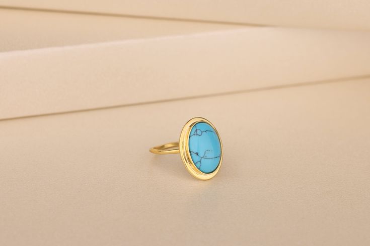 This beautiful Turquoise Ring is the perfect gift for yourself or your loved one. The ring is crafted in 10K, 14K and 18K solid gold, silver and shines with a beautiful turquoise gemstone. This elegant and sleek piece of jewelry makes a lovely addition to any jewelry collection. Details of the product Material: 10K and 14K Solid Gold, Silver Gemstone: Turquoise Gemstone Gemstone Size: 12x16 mm Unique Gift For people whom you love; Mom, Girlfriend, Wife, Fiance, Best Friend; Dainty Gift Idea; Valentine's Day Gift, Birthday Gift, Anniversary Gift, Gift For Engagement or Wedding, Promise Gift, Christmas Gift, Black Friday Gift, Mother's Day Gift, International Women's Day Gift, Memorial Gift. By gifting this elegant product to the most special person in your life, you can make them very happy Gold Turquoise Ring Birthstone For Gift, Gold Turquoise Ring For Gift, Gold Turquoise Ring Gift, Gold Turquoise Birthstone Ring Gift, Gold Oval Turquoise Ring Gift, Oval Gold Turquoise Ring Gift, Elegant Stackable Turquoise Open Ring, Elegant Stackable Open Turquoise Ring, Elegant Gold Turquoise Ring With Bezel Setting