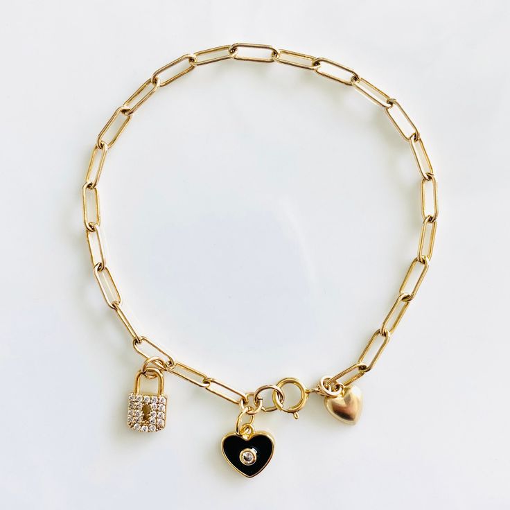 Loving these new heart charm bracelets. Something about them reminds me of the playfulness of childhood, but with an updated elegant (and adult) twist. These enamel charms are available in red, light pink, white, and black, and are all accented with a cubic zirconia. Charm also available in a cubic zirconia heart. If you like the looks of how some are styled in the pictures with multiple charms, please contact me for a customizable bracelet. Otherwise, each bracelet comes with 1 charm. Charms ar Adjustable Charm Bracelet With Heart Pendant, Adjustable Heart Charm Bracelet With Heart Pendant, Adjustable Heart Charm Bracelet, Friendship Bracelets With Double Heart Charm, Heart Pendant Charms Jewelry For Friendship, Adjustable Heart-shaped Charm Bracelet With Heart Charm, Friendship Heart Pendant Charms Jewelry, Friendship Dangle Jewelry With Removable Charms, Elegant Everyday Heart Bracelet With Charms