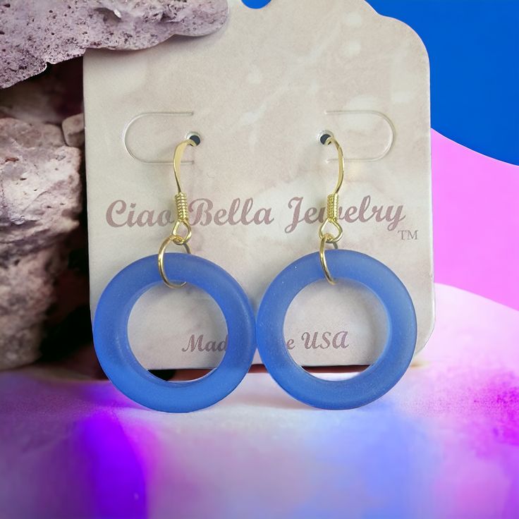 Description: Immerse yourself in the ocean's beauty with our enchanting Royal Blue Sea Glass Hoop Earrings. Handcrafted with genuine sea glass, these unique earrings capture the essence of the coast. The vibrant blue hue complements a variety of styles, making them perfect for both casual and dressy occasions. Experience the allure of the sea with every wear. Features: Genuine sea glass Royal blue color Handmade craftsmanship Gold earring hooks Versatile style Perfect for beach lovers and jewelr Blue Hoop Jewelry For The Beach, Blue Hypoallergenic Small Hoop Jewelry, Hypoallergenic Blue Small Hoop Jewelry, Blue Small Hoop Jewelry For The Beach, Blue Small Hoop Jewelry For Beach, Blue Hoop Earrings With Ear Wire For Beach, Blue Sea Glass Nickel-free Earrings, Nickel-free Blue Sea Glass Earrings, Blue Sea Glass Nickel Free Earrings