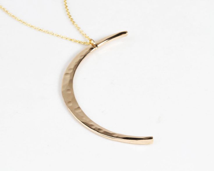 Experience celestial elegance with our Mystic Moon Necklace, where every detail is a testament to sustainable, handmade artistry, and made-to-order perfection. This exquisite necklace elevates celestial jewelry, radiating with handcrafted quality. Each moon pendant is meticulously hand forged by our team of skilled artisans, adding a personal touch to your piece. The graceful crescent moon is delicately hammered to mimic the moon's natural texture, measuring 44mm in length. Choose your Mystic Mo Mystic Moon, Crescent Moon Earrings, Crescent Moon Necklace, Celestial Jewelry, Wide Band Rings, Moon Earrings, Moon Pendant, Moon Necklace, Wide Bands