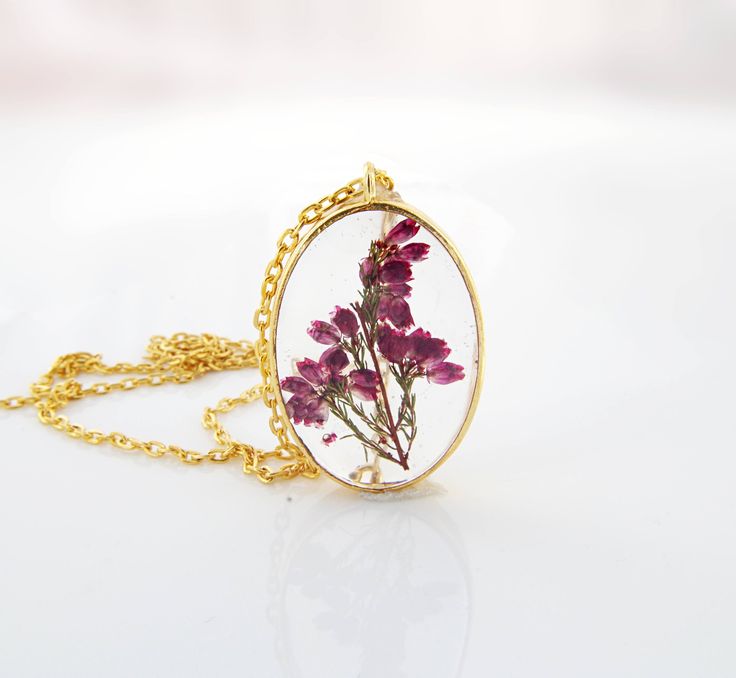 "Flower necklace / Terrarium jewelry / Mothers day gift for her / Pressed flower / Terrarium necklace / Plant jewelry Anniversary gift / gift for women / Woodland The pendant is a dainty gold plated open back bezel in an oval shape. They are so pretty, yet lightweight. The pendant measures about 1 1/3\" x 1\" oval (35mm x 25mm). A shiny silver tone 18\" snake chain is included. All jewelry items will come to you nicely packaged in a gift box. Purchase the listing below if you want to have your o Botanical Jewelry With Pressed Flowers, Botanical Flower Necklace For Mother's Day, Delicate Oval Pressed Flower Jewelry, Elegant Pressed Flower Necklace For Mom, Delicate Oval Jewelry With Pressed Flowers, Mother's Day Botanical Flower Jewelry, Nature-inspired Flower Charm Necklace For Gift, Nature-inspired Flower Shaped Necklace For Gift, Nature-inspired Flower Shape Necklace As A Gift