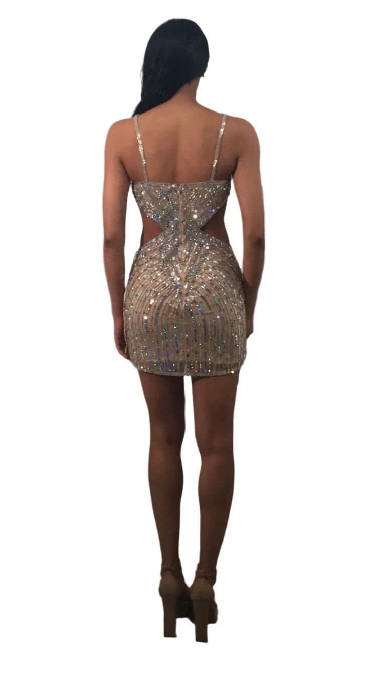 Expertly designed for any formal occasion, the Jovani 400610 Short Cut Out Homecoming Dress features dazzling beaded sequins and a stylish cut out design. This dress is perfect for making a statement and standing out from the crowd with its unique and eye-catching details. Elevate your look and show off your personal style with this elegant and sophisticated gown. Sizes: 00-14 Colors: Nude Glamorous Embellished Sequin Fabric For Prom, Glamorous Sparkling Sequin Fabric For Homecoming, Embellished Sequin Dress For Gala And Party Season, Embellished Sequin Dress For Gala Party Season, Embellished Sequin Fabric For Prom And Party Season, Backless Embellished Evening Dress For Night Out, Embellished Backless Evening Dress For Night Out, Elegant Sparkling Sequin Fabric For Homecoming, Glamorous Sequin Dress With Beaded Straps For Night Out