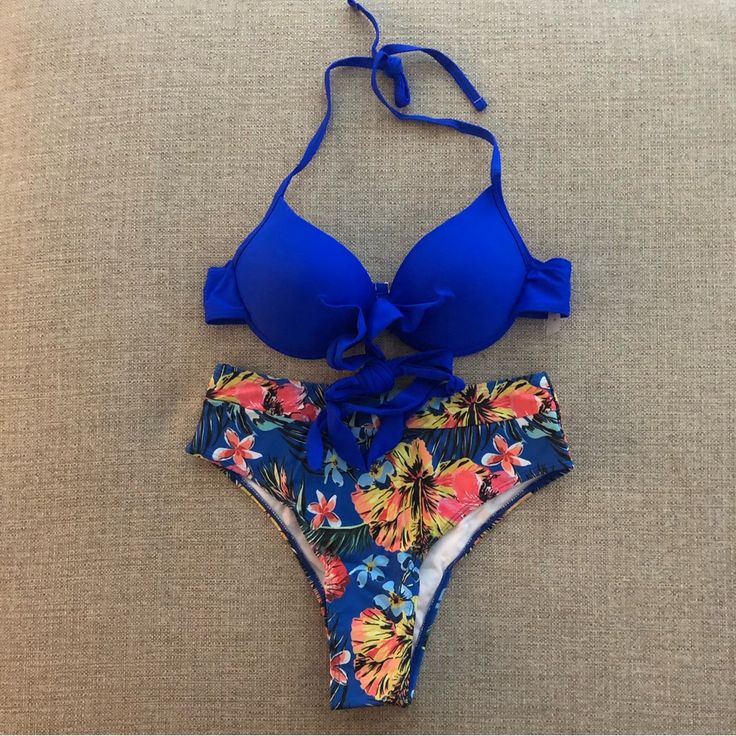 Get Ready To Soak Up The Sun In This Beautiful Two Piece Bikini That Features A Floral Print And High Cut Bottoms. The Underwire Molded Top Provides Comfortable Support While The Spaghetti Straps Add A Touch Of Femininity. This Bikini Is Perfect For Lounging By The Pool Or Taking A Dip In The Ocean. It Is Made Of A Blend Of Polyester And Spandex, Making It Comfortable And Easy To Care For With Machine Washability. The Bikini Comes In Size S And Is Ready To Make You Look And Feel Beautiful. Nwot Blue Stretch Tropical Swimwear, Blue Swimwear With Padded Cups For Pool, Blue Swimwear With Padded Cups For Swimming, Blue Swimwear With Padded Cups For Sunbathing, Blue Padded Swimwear For Pool, Yellow Swimwear With Padded Cups For Vacation, Blue Tropical Swimwear With Lined Body, Blue Tropical Style Swimwear With Lined Body, Yellow Padded Swimwear For Vacation