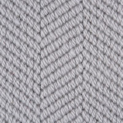 an up close shot of the texture of a knitted fabric in grey and white