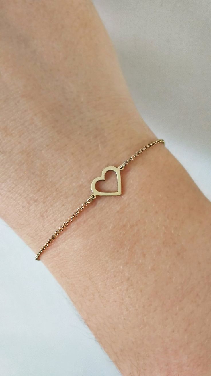 14K 9K Gold Heart Bracelet, Open Heart Bracelet, Solid Gold Heart Frame Bracelet, Love Forever Romantic Gift For Her, Dainty Heart Charm, Gift for Daughter, Girlfriend Gift, FREE EXPRESS SHIPPING Beautiful and delicate bracelet with a heart frame charm made in 14K or 9K solid gold. Whisper...Love Forever! Crescent Moon Bracelet: https://www.etsy.com/listing/747232649 -------------------------------------------------- D E T A I L S 14K Solid Gold or 9K Solid Gold Heart: 13mmx9mm Soldered chain an Open Heart Bracelet For Mother's Day Gift, Mother's Day Gift Open Heart Bracelet, Valentine's Day Gift: Open Heart Bracelet, Gold Heart Bracelet With Heart Beads For Mother's Day, Gold Heart Bracelets For Mother's Day, Heart-shaped Gold Bracelet For Mother's Day, Minimalist Double Heart Bracelet For Valentine's Day, Heart Pendant Bracelet For Valentine's Day Wedding, Minimalist Heart Bracelet For Anniversary