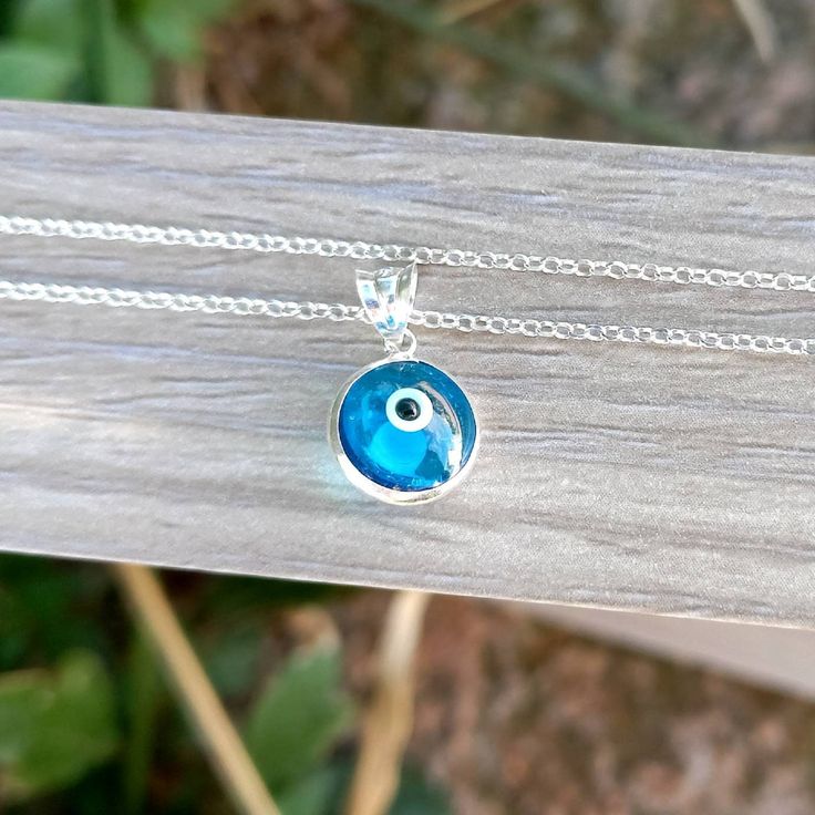 925 sterling silver authentic Greek blue evil eye necklace. High-quality chain. Elegant&dainty catching gently everyone's attention. Ideal for birthday or anniversary gift. Length approx. 16 inches / 40.5 cm with 1.5 inches extension. ♥ All items will be delivered in a nice gift envelope to minimize shipping expenses for you! You may choose gift wrapping at checkout if you wish! If you need it sooner, select expedited shipping at checkout and leave us a note with the wishing date! ★ Read our pol Blue Sterling Silver Charm Necklace, Nickel Free, Blue Jewelry With Silver Chain For Gifting, Blue Nickel-free Charm Necklaces For Jewelry Making, Blue Sterling Silver Charm Necklace Nickel Free, Blue Birthstone Charm Necklaces As Gift, Blue Birthstone Charm Necklaces For Gift, Blue Round Sterling Silver Jewelry, Blue Pendant Charm Necklaces For Spiritual Style, Blue Pendant Charm Necklace For Gift