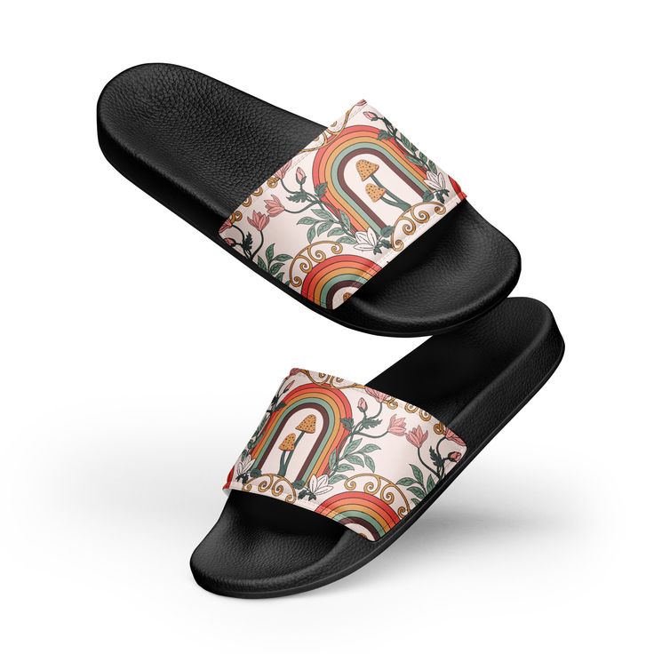 a pair of slippers with an image of a rainbow and flowers on the bottom