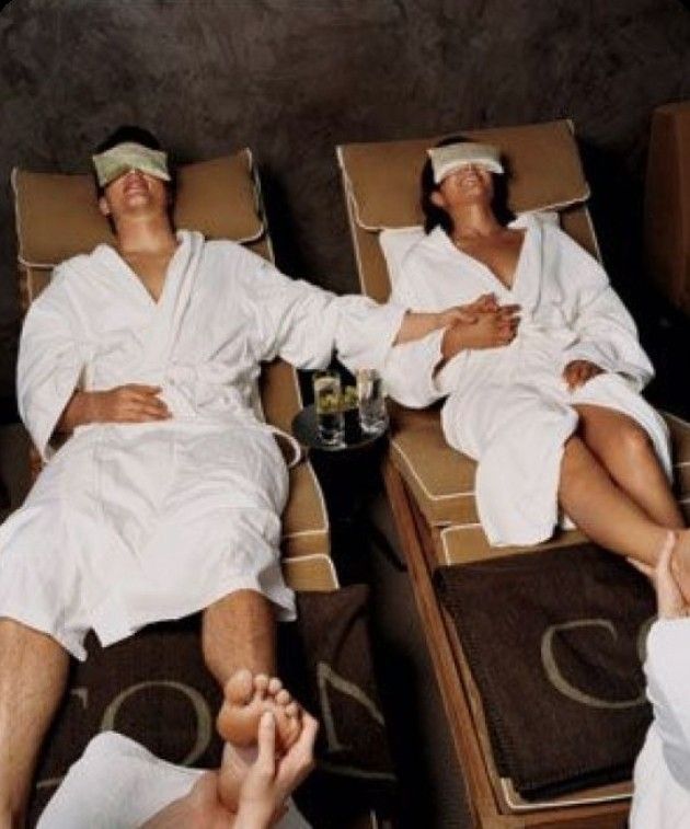 two people sitting in chairs with towels on their heads