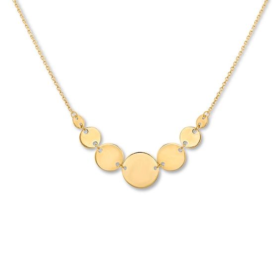 Round discs graduate in size from small to large in the center of this stylish necklace for her. Crafted of 14K yellow gold, the pendant suspends between an adjustable 16- to 18-inch cable chain that secures with a lobster clasp. Elegant Yellow Gold Coin Necklace With Adjustable Chain, Elegant Circle Necklace With Polished Finish, Elegant Round Coin Necklace With Clavicle Chain, Elegant Round Pendant Coin Necklace With Polished Finish, Elegant Round Coin Necklace With Delicate Chain, Elegant Round Coin Necklace With Chain, 14k Yellow Gold Circle Necklace, Modern Yellow Gold Necklace With Adjustable Chain, 14k Gold Circular Coin Pendant Necklace