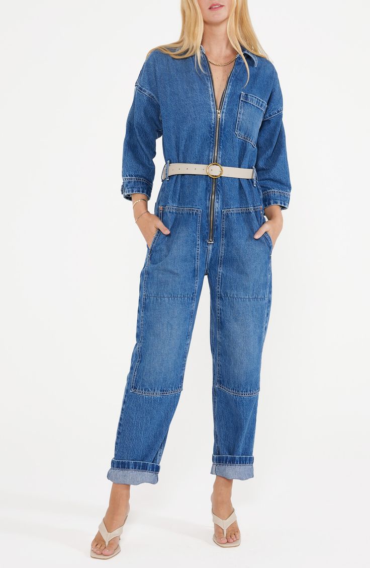 With a classic blue wash, this belted jumpsuit with a zip-front closure and plethora of pockets is a stylish way to make an all-denim statement. Point collar Three-quarter sleeves 77% cotton, 23% Tencel® Refibra™ lyocell Tencel Refibra lyocell is a sustainably produced fiber made from wood pulp and recycled cotton scraps using closed-loop processing Machine wash, line dry Imported Denim Jumpsuit With Belt Loops For Workwear In Spring, Spring Denim Jumpsuit For Work With Belt Loops, Spring Denim Jumpsuit With Belt Loops For Work, Casual Denim Jumpsuit With Belt Loops For Work, Blue Denim Jumpsuit With Zipper Closure, Spring Denim Belted Jumpsuits And Rompers, Denim Belted Overalls Jumpsuits And Rompers, Casual Denim Belted Jumpsuits And Rompers, Casual Denim Belted Jumpsuit