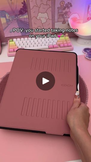 a person using a pink laptop computer on a desk with the caption pov you started taking notes on your ipad