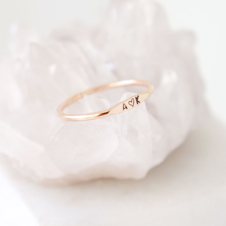 The Wave Initial Ring Our slim 1.3 mm band is hand formed, soldered, hammered and stamped with your tiny initial or monogram (up to 3 characters). Wear one, or stack them for all your loves. ♥ This listing is for one ring; add multiple quantities to your cart for more. {DETAILS}: * 1.3 mm band (2 mm where initial sits) * 1.5 mm initial * your choice of sterling silver, 14k gold fill, rose gold fill or solid 14k gold! ►Lots more stacking rings for...stacking! http://etsy.me/1U0RlXp ►Silver heart Personalized Dainty Initial Ring In Rose Gold, Personalized Dainty Rose Gold Initial Ring, Dainty Rose Gold Sterling Silver Initial Ring, Dainty Personalized Rose Gold Initial Ring, Dainty Rose Gold Initial Ring, Minimalist Initial Rose Gold Ring, Minimalist Sterling Silver Stackable Rings With Initials, Minimalist Rose Gold Initial Ring For Anniversary, Minimalist Midi Rings With Initials