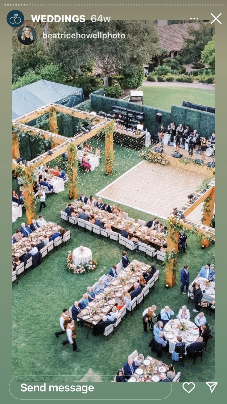 an aerial view of a wedding reception with tables and chairs set up in the grass