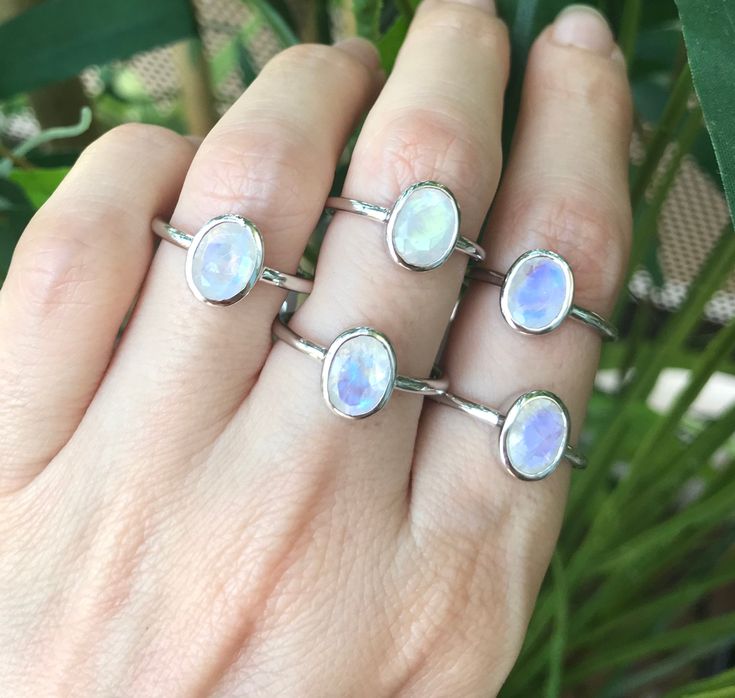 "A stackable sterling silver ring featuring a faceted oval-shaped Rainbow Moonstone set in a simple bezel setting, which makes a great birthstone ring for those June Birthdays. Wrapped in a box ready for gift giving.(r-new-29) Rainbow Moonstone measure 8mm x 6mm *Follow us @belesasjewelry on Instagram for promotions/giveaways *LIKE* us on Facebook http://www.facebook.com/Belesas to find special coupon codes *If you like the ring, please click on the \"Pin It\" icon ------------------------------ Adjustable Oval Gemstone Stackable Rings, Adjustable Stackable Oval Midi Rings, Adjustable Oval Nickel-free Moonstone Ring, Dainty Oval Crystal Stackable Ring, Adjustable Oval Gemstone Midi Rings, Dainty Oval Crystal Ring, Stackable, Dainty Oval Crystal Ring Stackable, Stackable Rings With Moonstone Gemstones, Moonstone Stackable Rings For Gift