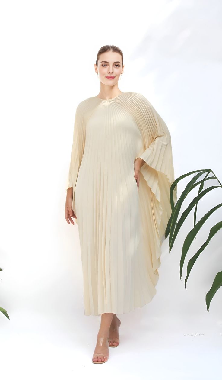 "A special collection with pleated kaftan in fan-style will bring the best \"new\" look for any occasions you may attend. Classic but chic !. It's totally smoothly flowy, soft and gentle touch. FEATURES - Lilac, Light Purple  - Pleated - Personal Custom Made - Full Length Kaftan  - Designer Silk Kaftan - Plus Size and Custom Length - Resort Wear, Beach Wear, Lounge Wear, Pool Cover Up Kaftan - Boat Neck -------------------------------- DETAIL  * The maximum length : 134 CM ( please be noted, this can not cut shorter or extended longer due to the fabric's nature) * The width : Around 130-134 CM (flat measurement) or full circumference 260-264 CM *  The width ( between the sewing line to sewing line) : around 70-72 CM ( flat measurement) or full circumference 140-144CM  *This fit well up to Elegant Flowy Spring Abaya, Elegant Abaya With Cape Sleeves, Elegant Summer Maxi-length Thobe, Elegant Summer Maxi Thobe, Elegant Maxi Length Summer Thobe, Elegant Beige Long Thobe, Elegant Long Beige Thobe, Elegant Long Cream Abaya, Elegant Tunic Maxi Dress For Eid