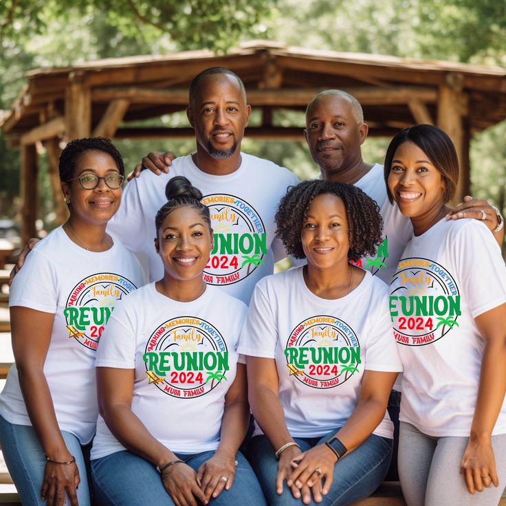 a group of people wearing reunion t - shirts sitting on a bench in front of a gazebo