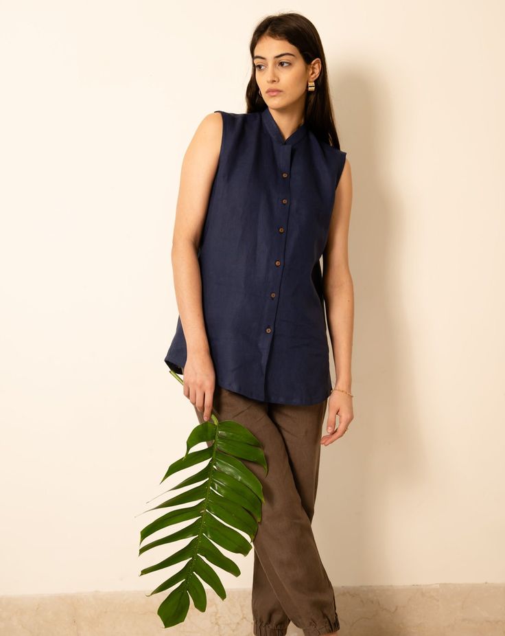 Made from our softest linen, SASHA Sleeveless Linen Shirt is the ideal daily companion for a laid-back day out and relaxed WFH wear. In 100% sustainable comfort with minimal styling and a roomy fit, even the buttons decompose! Breathable and lightweight to keep you cool and encourage greater energy. Materials Our products are made from 100% Pure European-grade Linen Fabric, making it ideal for the warm climates. Linen Shirt With Buttons For Casual Gatherings, Casual Relax Fit Flax Shirt, Linen Tops With Buttons For Casual Gatherings, Relaxed Fit Cotton Blouse In Beige, Flax Cotton Relaxed Fit Blouse, Flax Cotton Blouse With Relaxed Fit, Flax Linen Top With Button Closure, Flax Cotton Top With Buttons, Casual Flax Cotton Blouse