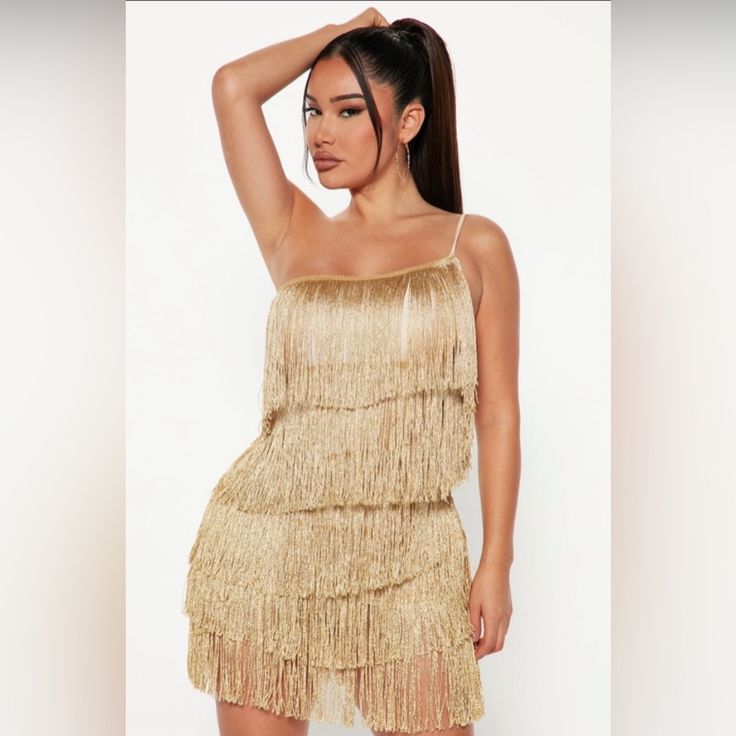 Go In 70’s Style! Chic Fringe Club Dresses, Spring Club Mini Dress With Fringe, Spring Fringe Mini Dress For Club, Gold Mini Dress For Club In Spring, Gold Mini Dress For Spring Clubbing, Flirty Fringe Mini Dress For Party, Summer Midi Dress With Fringe For Date Night, Gold Fringe Party Dress, Disco Style Dresses For Club And Spring Season