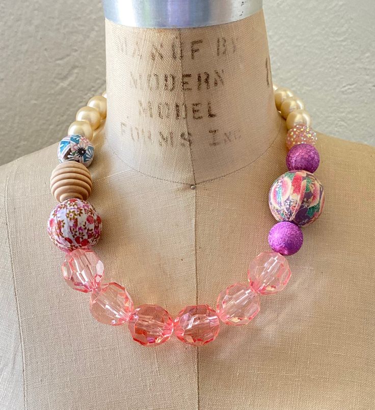 Feminine shades of pink with handmade decoupage beads covered in vintage prints Vintage Hand Painted Pink Jewelry, Handmade Pink Necklaces For Spring, Hand Painted Pink Jewelry For Party, Spring Pink Beaded Necklace, Handmade Pink Beaded Necklace For Summer, Pink Wooden Beaded Necklaces For Gifts, Pink Wooden Beads Necklace For Gift, Pink Bohemian Necklace With Large Beads, Pink Round Beads Necklace For Spring