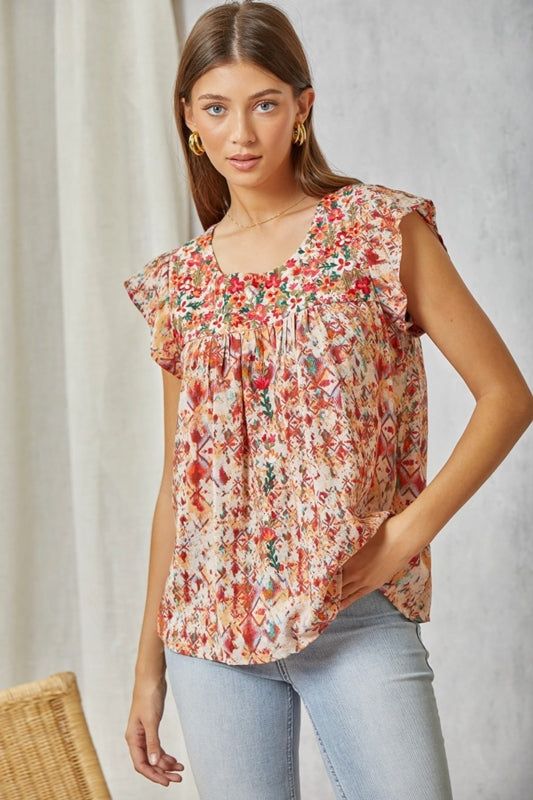 Savanna Jane Artistic print blouse, featuring embellished floral embroidery at neckline front and back and flowers on front. Non sheer. Round neckline. Ruffle flutter cap sleeves. Super pretty! Color: Multi Sizes: S-M-L-XL Bust 36-38-40-42, Length 26-2783% Rayon, 17% Nylon, hand wash cold, imported C4/16369-14 Spring Printed Blouse With Butterfly Sleeves, Spring Blouse With Printed Butterfly Sleeves, Spring Floral Print Blouse With Butterfly Sleeves, Printed Flutter Sleeve Tops For Summer, Printed Flowy Tops With Flutter Sleeves, Flowy Printed Tops With Flutter Sleeves, Flowy Multicolor Flutter Sleeve Tops, Multicolor Flowy Tops With Flutter Sleeve, Summer Floral Print Blouse With Butterfly Sleeves